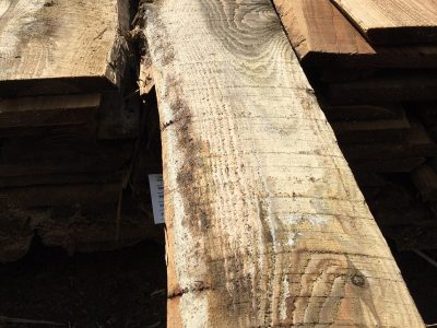 3.6m x 125/200mm (average) x 18mm Waney Edge treated softwood board